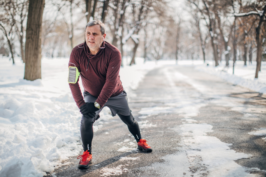 Older Man Stretching Outside in the Winter