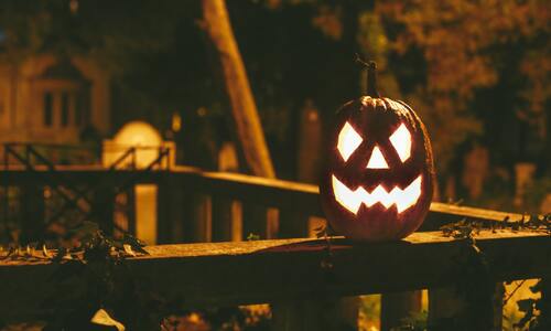 Candle Lit Pumpkin in Halloween Season