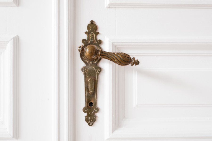 Old Door Handle Closeup in Beautiful Apartment Interior