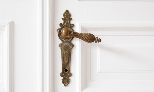 Old Door Handle Closeup in Beautiful Apartment Interior