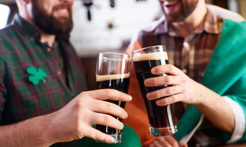 St. Patrick's Day friends cheers over dark beer